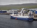 The Rockall a Deep sea Trawler tied up alongside the Shetland Catch Quay in Lerwick on a Misty day in August.