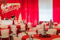 Rockaway, NJ - 12/08/17 - Holiday Party in red and white themed decor, silver tinsel tree in focus