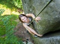 Rockclimber helping to female climber to reach top of mountain Royalty Free Stock Photo