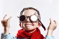 Boy in blue shirt, red scarf, biker glasses and bandana on light background Royalty Free Stock Photo