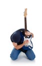 Rocker playing guitar kneeling Royalty Free Stock Photo