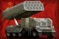 Rocket artillery, missile launcher with grey camouflage on the Soviet Union SSSR, USSR national flag background. 9 May, Victory