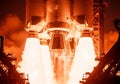 Rocket engines igniting with bright orange flames and white smoke Royalty Free Stock Photo