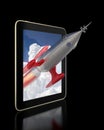 Rocket flying out of a Tablet Royalty Free Stock Photo