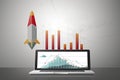 Rocket from laptop start up concept.Abstract business chart with line graph Royalty Free Stock Photo
