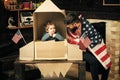 Rocket launch concept. Kid happy sit in hand made rocket with usa flags. Child cute boy play cosmonaut, astronaut