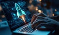 Rocket launch concept on laptop screen with hands typing in digital workspace Royalty Free Stock Photo