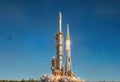Rocket Launch at Dawn - Powerful Spacecraft Ascending Through Blue Sky with Brilliant Flame Royalty Free Stock Photo