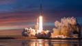 Rocket launch at sunset with bright flames, smoke cloud and reflection on water Royalty Free Stock Photo