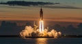 Rocket launch at sunset with dramatic sky. Royalty Free Stock Photo