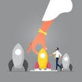 Rocket leadership concept-Big hand picking the leader Royalty Free Stock Photo