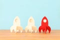 rocket leadership concept. red rocket as leader of the group. idea of standing out of the crowd Royalty Free Stock Photo