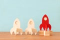 rocket leadership concept. red rocket as leader of the group. idea of standing out of the crowd Royalty Free Stock Photo