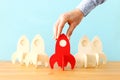 Rocket leadership concept. red rocket as leader of the group. idea of standing out of the crowd Royalty Free Stock Photo