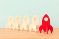 Rocket leadership concept. red rocket as leader of the group. idea of standing out of the crowd Royalty Free Stock Photo