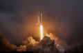 Rocket liftoff. Shuttle spaceship launch in the clouds sky. Spaceship begins the mission. Space shuttle taking off on a mission. Royalty Free Stock Photo