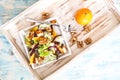 Rocket with orange and beetroot salad on a wood board Royalty Free Stock Photo