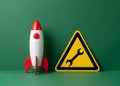Rocket and repair sign. Startup in progress. Product under testing. Investor feedback processing Royalty Free Stock Photo