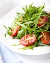 Rocket salad with cherry tomatoes Royalty Free Stock Photo