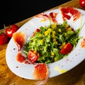 Rocket salad with dried Spanish ham Royalty Free Stock Photo