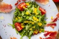 Rocket salad with dried Spanish ham Royalty Free Stock Photo
