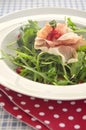 Rocket salad with parma ham and pomegranite seeds