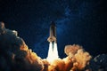 Rocket takes off in the starry sky. Spaceship begins the mission. Space shuttle taking off on a Planet Mars Royalty Free Stock Photo