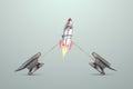 The rocket is trying to get off the ground, tied by a chain to an anvil. Startup concept, problems, new beginning, getting out of
