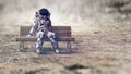 Rocketman on bench. Mixed media Royalty Free Stock Photo