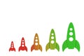 Rockets color from red to green are in order of increasing on a white background. The concept of space and technology, travel to t Royalty Free Stock Photo