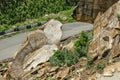 Rockfall on the road in the mountains.