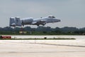 A military A-10 Thunderbolt airplane in takeoff motion at the annual Rockford Airfest on July 31, 2010 in Rockford, IL