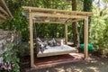 Rocking bed pergola. Garden bed with pillows