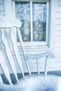 Rocking Chair and Lace Curtained Window