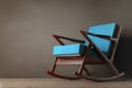 Rocking Chair Upholstered with Blue Cloth. 3d Rendering Royalty Free Stock Photo