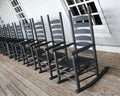 Rocking chairs lined up on the porch Royalty Free Stock Photo