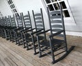 Rocking chairs lined up on the porch
