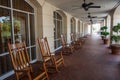 Rocking Chairs on a Long Tile Porch Royalty Free Stock Photo