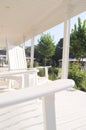 Rocking Chairs on a White Wrap Around Porch Royalty Free Stock Photo