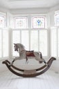 Rocking Horse In Bay Window Royalty Free Stock Photo