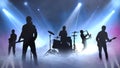 Rocking to the Beat Silhouettes on Stage Royalty Free Stock Photo