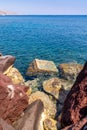 Rocks against a blue colored ocean, santorini island, greece