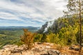 Rocks of Aigir in the smoke of a forest fire. Royalty Free Stock Photo