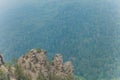 Rocks of Aigir in the smoke of a forest fire. Bashkortostan. Royalty Free Stock Photo