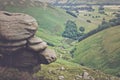 Rocks and on the background is a picturesque view on the hills, Peak District National Park, Derbyshire, England, UK.