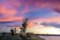 Rocks balance with sunset clouds sky backgrounds