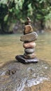 Stack of balanced stones in river Royalty Free Stock Photo