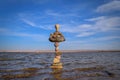 Rocks balanced in the tranquil body of water