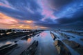 Rocks in Barrika beach with dramatic sky