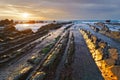 Rocks in Barrika beach with golden reflections